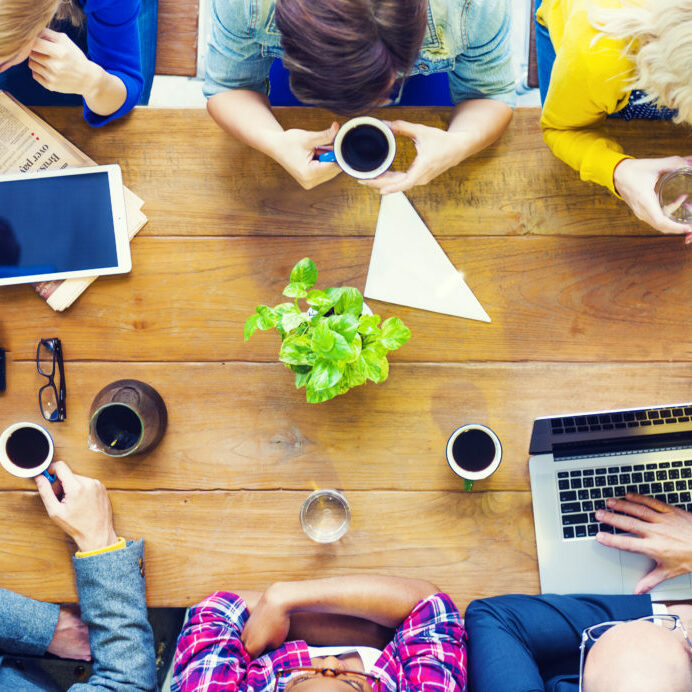 Multiethnic People with Startup Business Talking in a Cafe